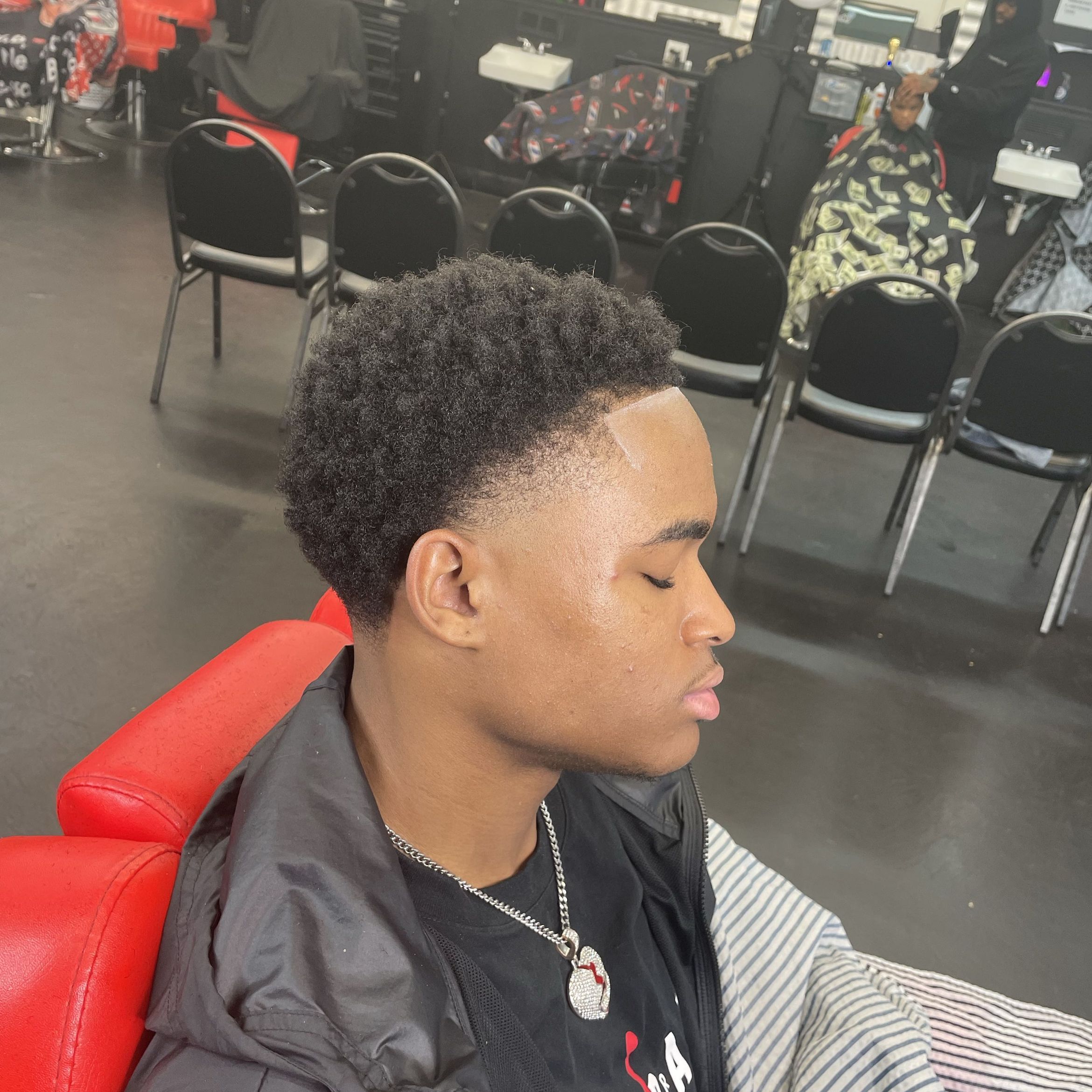 Taper cut (sides of head) with line portfolio