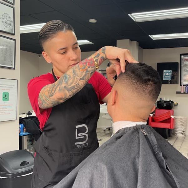 Kimberly Flores-Arce - Kim’s Royal Cuts barbershop